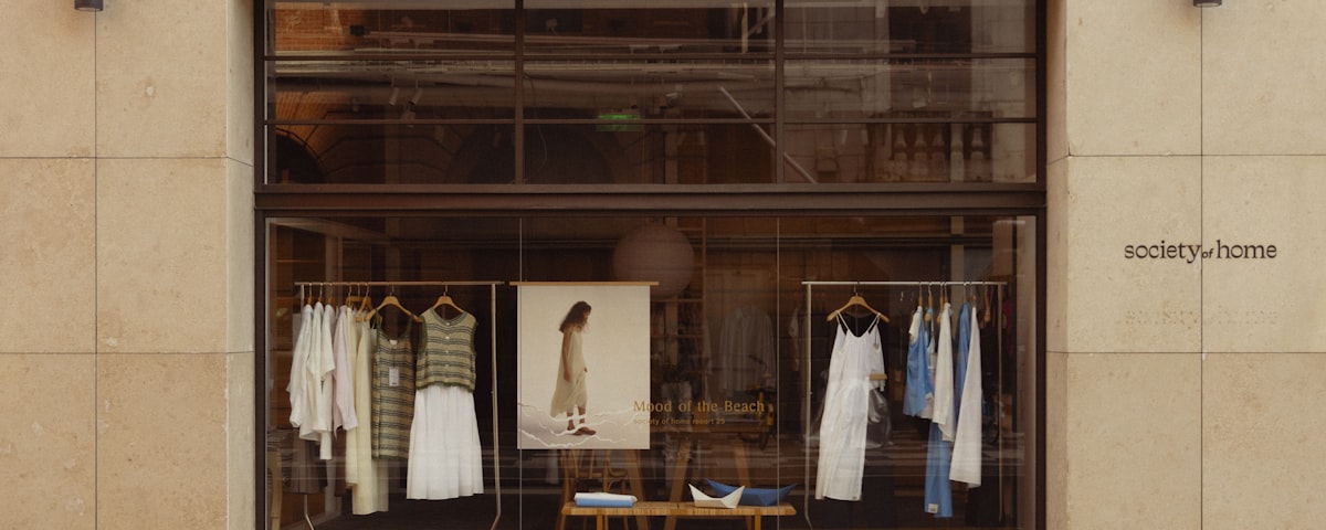 Clothing store window display with curated racks